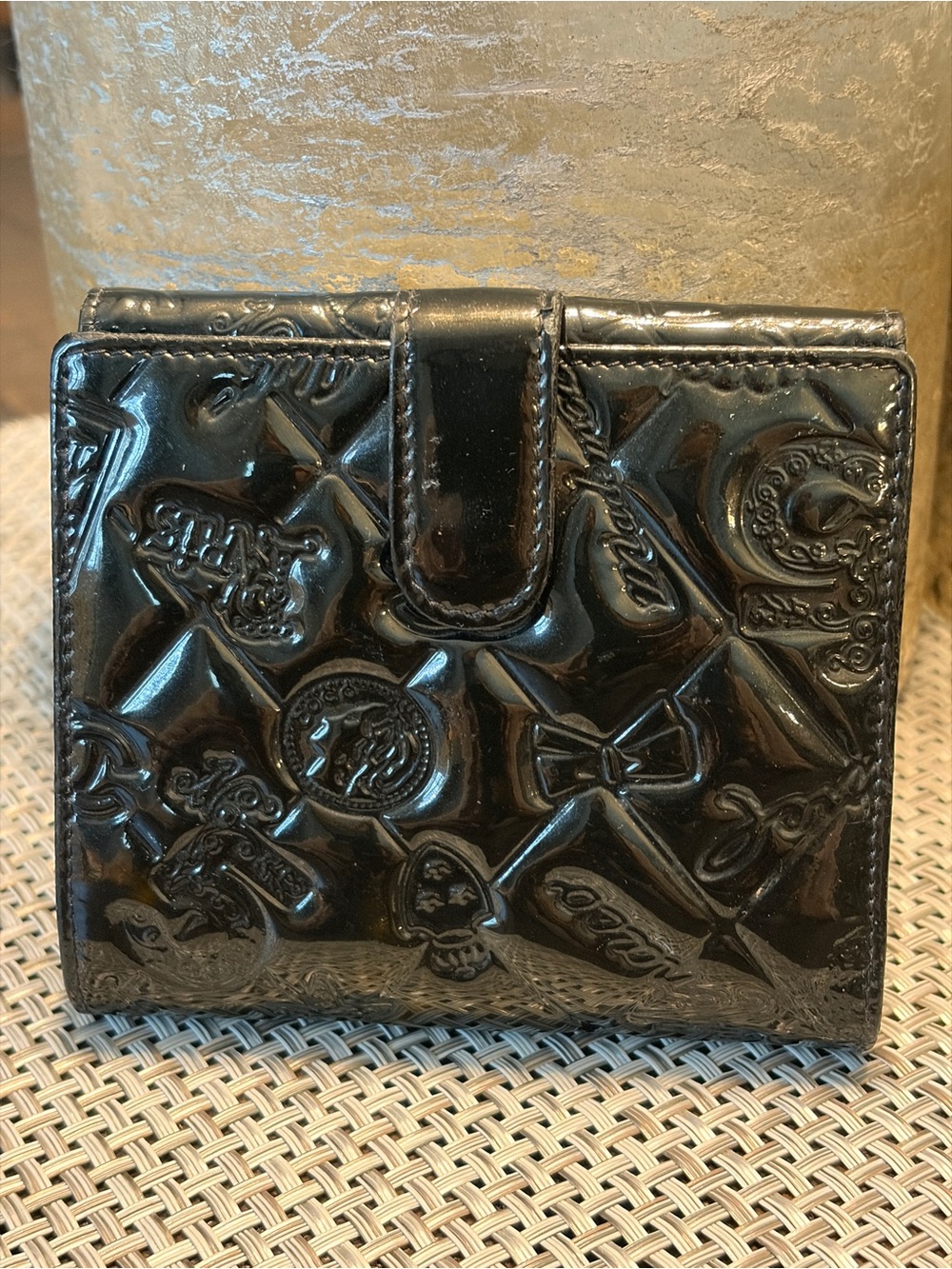 Glossy Embossed Black Wallet with Snap Closure